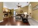 Living room with stone fireplace, laminate floor, and open concept layout at 1430 Rosetree Ct, Clearwater, FL 33764