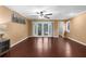 Living room with hardwood floors and view of backyard pool at 1430 Rosetree Ct, Clearwater, FL 33764