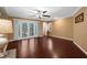 Spacious living room with hardwood floors, natural light, and access to outdoor spaces at 1430 Rosetree Ct, Clearwater, FL 33764