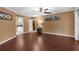 A large living room with hardwood floors, neutral tones, and decorative art at 1430 Rosetree Ct, Clearwater, FL 33764