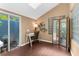 Bright sun room featuring access to outdoor space and unique glass block window at 1430 Rosetree Ct, Clearwater, FL 33764