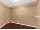 Spacious walk-in closet with ample storage shelving and modern flooring at 1430 Rosetree Ct, Clearwater, FL 33764