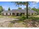 Well-kept single-story home featuring a neat lawn, traditional design, and a welcoming entrance at 14645 Spellman Ct, Spring Hill, FL 34610