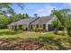 Charming single-story home with well-maintained landscaping and a welcoming front yard at 14645 Spellman Ct, Spring Hill, FL 34610