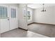 Inviting entryway with tile flooring, double doors, and views into adjacent carpeted room at 14645 Spellman Ct, Spring Hill, FL 34610