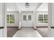 Bright foyer featuring tile flooring, double doors, neutral paint, and abundant natural light at 14645 Spellman Ct, Spring Hill, FL 34610