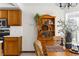 Eat-in kitchen with stainless steel appliances, light countertops, and a wood bookshelf at 14645 Spellman Ct, Spring Hill, FL 34610