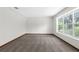 Neutral room featuring carpeted floors, a large window, and a fresh, clean interior at 14645 Spellman Ct, Spring Hill, FL 34610
