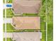 Aerial view of the houses showing the roofs, yards and driveways at 15004 Middle Fairway Dr, Spring Hill, FL 34609