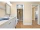Well-lit bathroom featuring a glass-enclosed shower and neutral color scheme at 15004 Middle Fairway Dr, Spring Hill, FL 34609