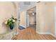 Welcoming foyer with wood floors, arched entryway, and views into adjacent rooms at 15004 Middle Fairway Dr, Spring Hill, FL 34609