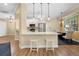Eat-in kitchen featuring white cabinetry, a breakfast bar, and stainless steel appliances at 15004 Middle Fairway Dr, Spring Hill, FL 34609