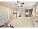 Spacious main bedroom with a ceiling fan and access to a private screened patio at 15004 Middle Fairway Dr, Spring Hill, FL 34609