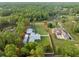 Aerial view of the property showcasing lush greenery, neighboring houses, and serene surroundings at 15430 Oakcrest Cir, Brooksville, FL 34604