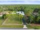 Aerial view of lovely single Gathering home, grounds, and long driveway leading to the street at 15430 Oakcrest Cir, Brooksville, FL 34604