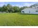 Spacious backyard with lush lawn area at 15430 Oakcrest Cir, Brooksville, FL 34604