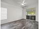 Modern bedroom with sliding glass doors leading to an outdoor patio at 15430 Oakcrest Cir, Brooksville, FL 34604