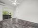 Modern bedroom with sliding glass doors leading to an outdoor patio and spa at 15430 Oakcrest Cir, Brooksville, FL 34604
