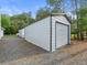 Detached, one-car, metal garage at 15430 Oakcrest Cir, Brooksville, FL 34604