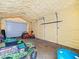 Interior of garage with insulated walls and toys at 15430 Oakcrest Cir, Brooksville, FL 34604