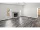 Bright living room features tile floors and a fireplace at 15430 Oakcrest Cir, Brooksville, FL 34604