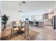 Bright dining area next to kitchen and living room, with hardwood-style floors and open space at 18743 W Coastal Shore Ter, Land O Lakes, FL 34638