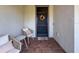 Cozy front porch with seating, decorative wreath, and a welcoming doormat at 18743 W Coastal Shore Ter, Land O Lakes, FL 34638