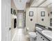 Neutral bathroom with a walk-in shower, granite countertop, and ample lighting at 22850 Skyview Cir, Brooksville, FL 34602