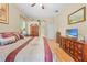 Spacious bedroom with wooden floors, ample storage, and natural light from a window at 22850 Skyview Cir, Brooksville, FL 34602