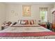 Comfortable bedroom featuring an oversized bed, warm colors, and decorative accents at 22850 Skyview Cir, Brooksville, FL 34602