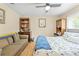 Comfortable bedroom showcasing a plush loveseat and complementary furnishings at 22850 Skyview Cir, Brooksville, FL 34602