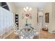 Charming dining room with a glass table, decorative accents, and abundant natural light at 22850 Skyview Cir, Brooksville, FL 34602