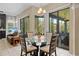 The breakfast nook features sliding glass doors and windows for lovely natural light at 22850 Skyview Cir, Brooksville, FL 34602