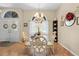 Bright dining room with glass table, chairs and ample natural light at 22850 Skyview Cir, Brooksville, FL 34602