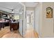 Hallway leading to bathroom and office with hardwood floors at 22850 Skyview Cir, Brooksville, FL 34602