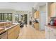 Bright kitchen featuring stainless appliances, tile floors, and a dining area overlooking the backyard at 22850 Skyview Cir, Brooksville, FL 34602