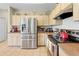 Kitchen with stainless steel refrigerator, microwave, and range at 22850 Skyview Cir, Brooksville, FL 34602