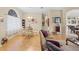 Open-concept living room and dining area with ample seating and stylish decor, perfect for entertaining at 22850 Skyview Cir, Brooksville, FL 34602