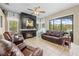 Cozy living room features a fireplace, comfortable seating, and natural lighting at 22850 Skyview Cir, Brooksville, FL 34602