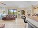 Open concept living room features natural lighting and access to the backyard at 22850 Skyview Cir, Brooksville, FL 34602