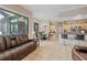 Bright living space with tile floors, an open layout, and access to the outdoor area through sliding glass doors at 22850 Skyview Cir, Brooksville, FL 34602
