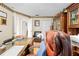 Spacious home office featuring wooden furniture, a leather chair, and large desk space at 22850 Skyview Cir, Brooksville, FL 34602
