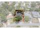 Aerial view of property in neighborhood with mature trees and defined property lines at 2295 Rio Cir, Spring Hill, FL 34608