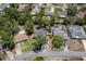 Aerial view of property in neighborhood with mature trees on a sunny day at 2295 Rio Cir, Spring Hill, FL 34608
