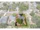 Aerial view of property in neighborhood with defined property lines and mature trees at 2295 Rio Cir, Spring Hill, FL 34608
