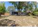 Spacious backyard with a cozy gazebo, providing a relaxing outdoor area and a glimpse of the home's exterior at 2295 Rio Cir, Spring Hill, FL 34608