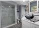 Updated bathroom features a glass enclosed shower and modern sink at 2295 Rio Cir, Spring Hill, FL 34608