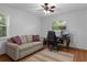 Bright bedroom with a comfortable couch and a functional workspace for relaxation and productivity at 2295 Rio Cir, Spring Hill, FL 34608
