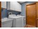 Laundry room featuring modern appliances and ample storage space at 2295 Rio Cir, Spring Hill, FL 34608