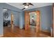 Spacious living room with wooden doors and wood-look floors at 2295 Rio Cir, Spring Hill, FL 34608